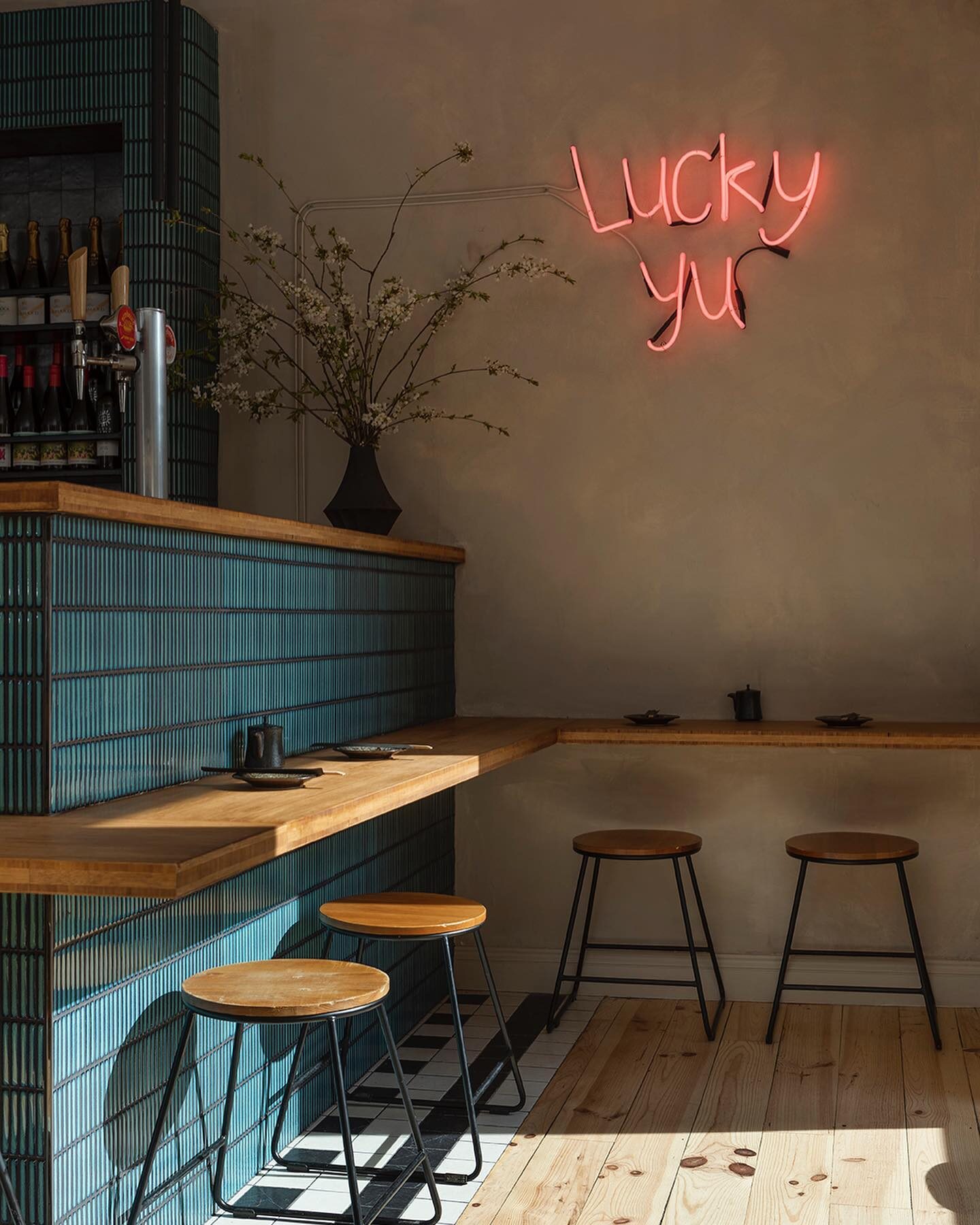 Lucky Yu bar fit-out with teal tiled bar and oak counter
