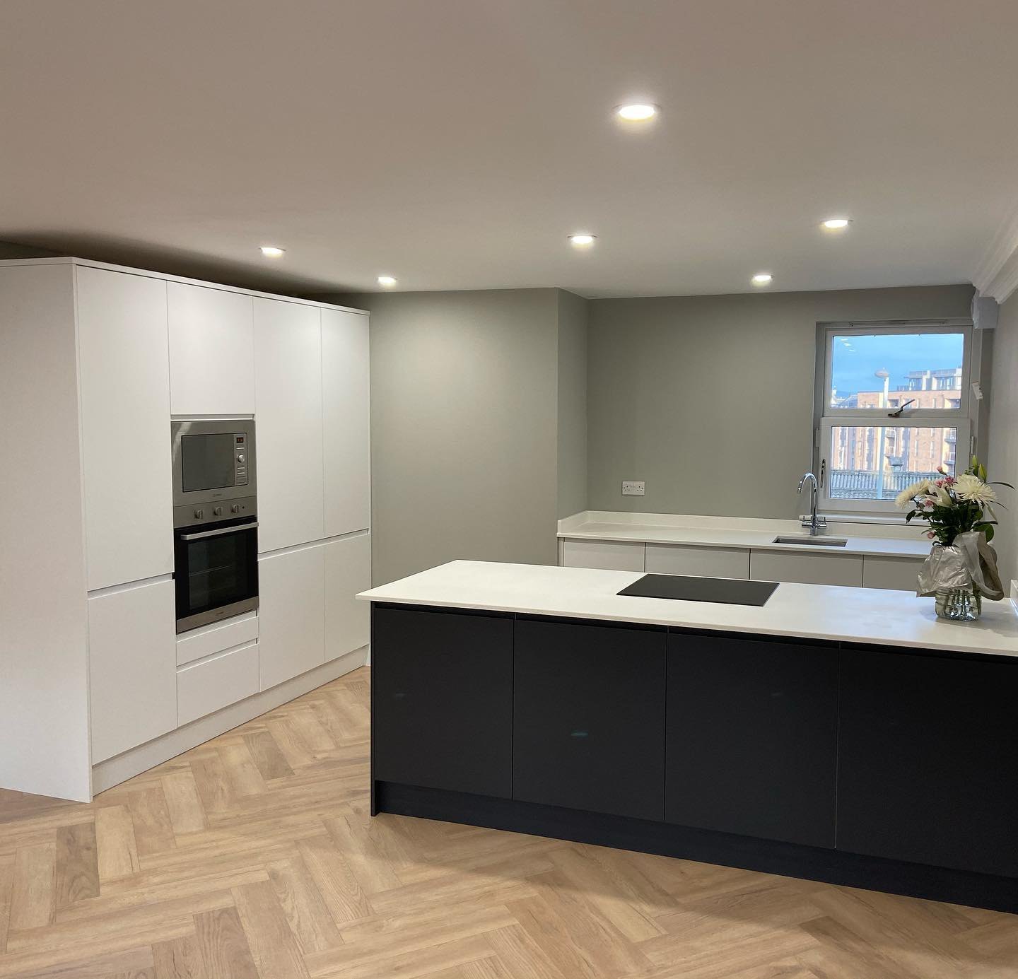 Considered interior project — modern finished kitchen with herringbone oak floor