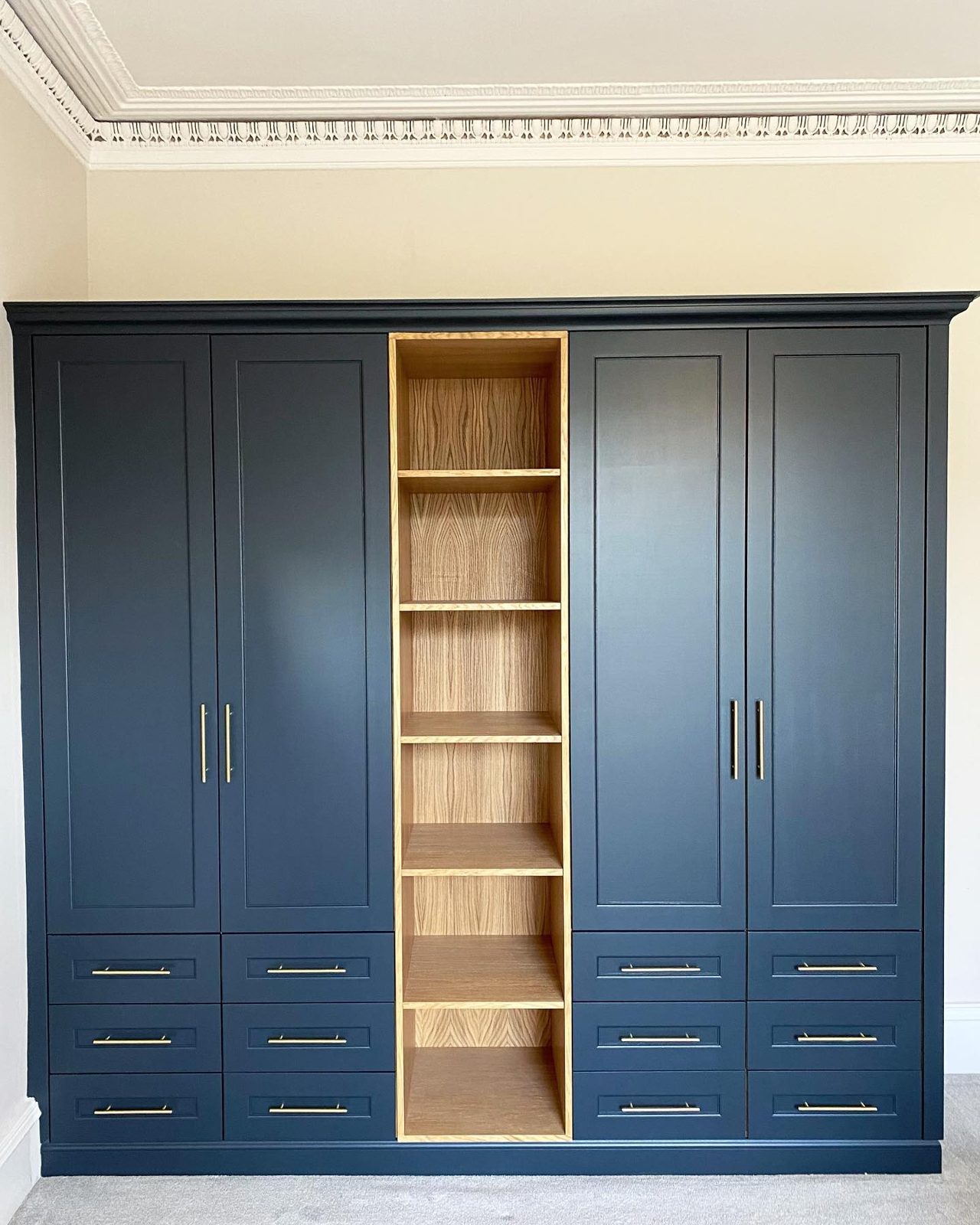 Bespoke navy fitted wardrobe by CMD Joinery